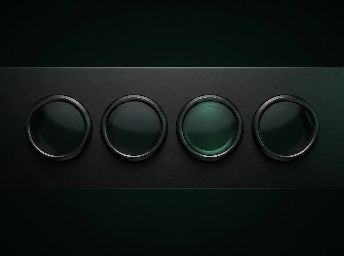 Four unmarked instrument bezels in a metal panel, one lit green